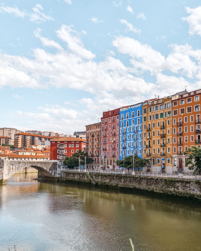 Colorful houses along the Nervión River in Bilbao, Spain